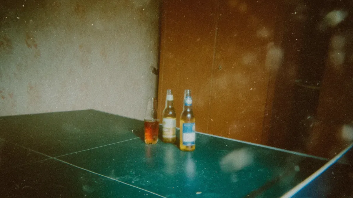No more beer and ping pong for me beer bottles on top of a ping pong table