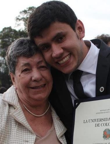Graduation photo with my grandmother and the diploma
